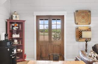 Guest house door to front porch from living area