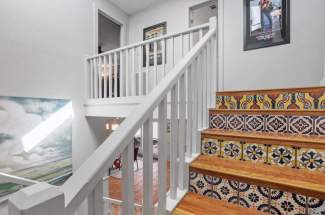 Stairway to upstairs media room and guest bedroom/bathroom