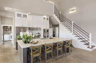 View from kitchen to staircase to guest rooms