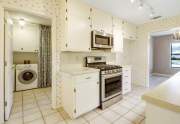 Kitchen looking into laundry